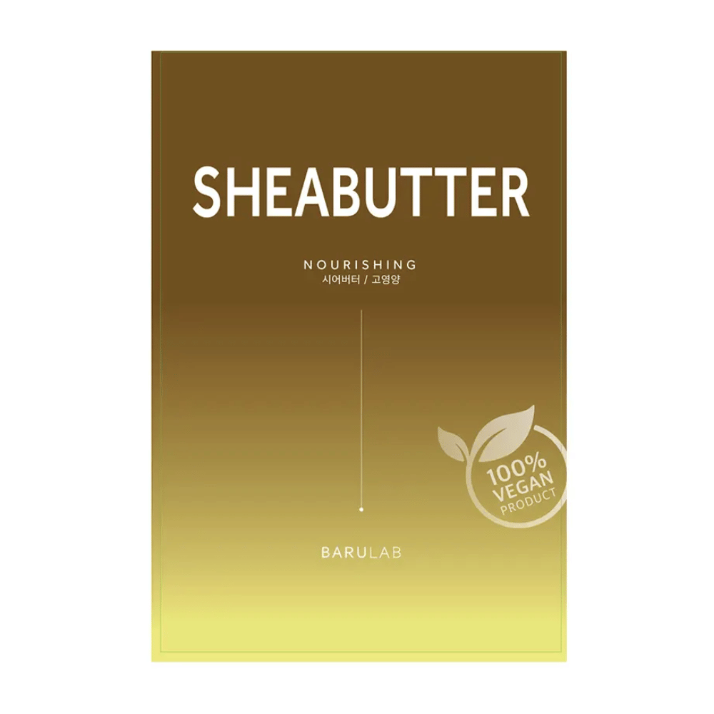 Eine Verpackung der BARULAB "SHEABUTTER Nourishing" Maske, gekennzeichnet als "100% Vegan Product". Die Verpackung hat einen Farbverlauf, der von dunklem Goldbraun oben zu hellem Gelb unten übergeht.
