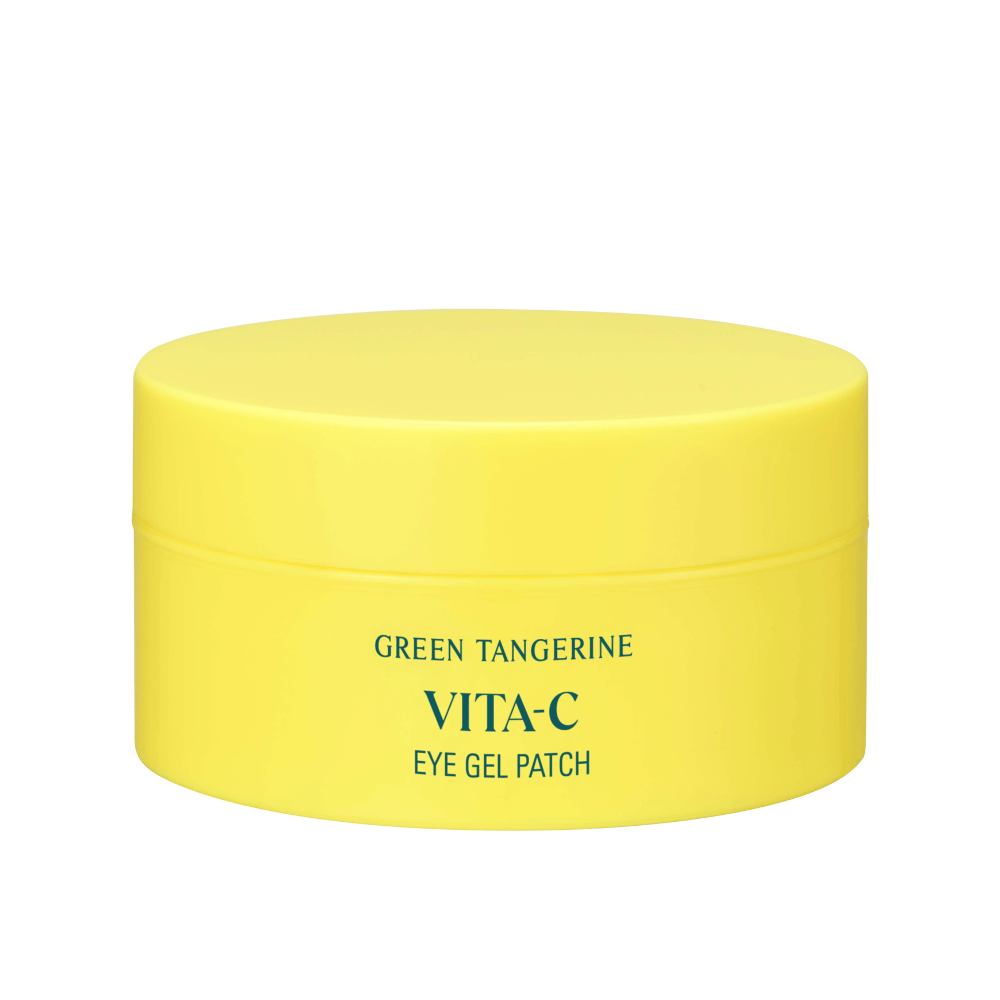 Eine gelbe Dose mit der Aufschrift "GREEN TANGERINE VITA-C EYE GEL PATCH", wahrscheinlich Augenmasken, die Vitamin C enthalten.