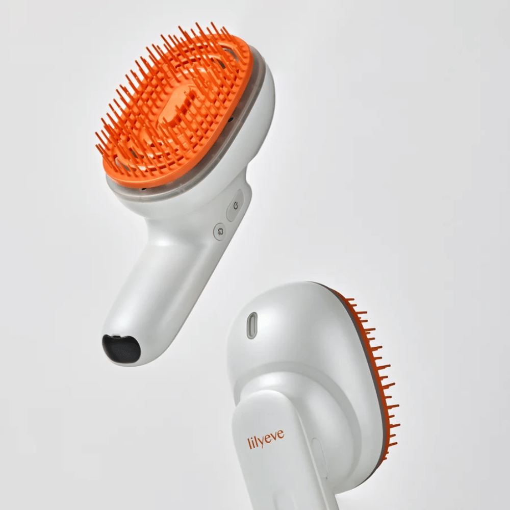 LILYEVE GrowTurn Brush Steam Booster – Vorder- und Rückseite mit ergonomischem Griff und orangefarbenen Borsten
