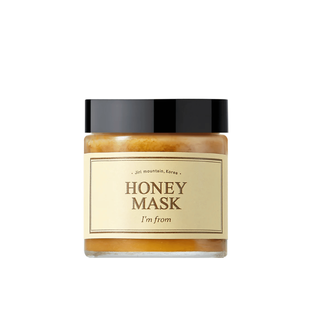  Ein Glas "I'm from Honey Mask", mit natürlichem Honiganteil, vor weißem Hintergrund.