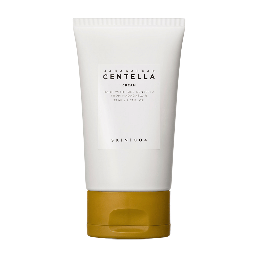 Das Bild zeigt eine Tube mit "Madagascar Centella Cream" von SKIN1004. Es ist eine Hautcreme, die aus reiner Centella aus Madagaskar hergestellt wird und in einer 75 ml / 2.53 fl.oz. Verpackung kommt. Das Produkt ist zur Hautpflege gedacht, um der Haut Nährstoffe und Feuchtigkeit zu spenden.