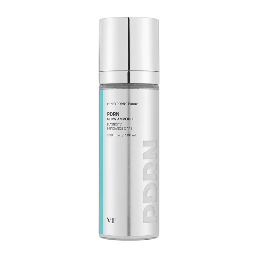 VT PDRN Glow Ampoule i en silverfärgad flaska med pump, märkning som indikerar innehåll på 100 ml. Produkten är designad för elasticitet och strålande hud, med texten "PHYTO PDRN® Panax" och "Elasticity & Radiance Care".