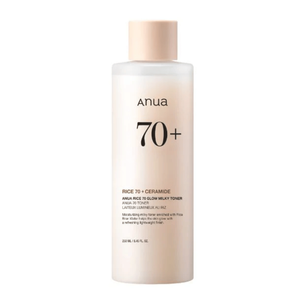 Eine Flasche "Anua 70+ Rice Ceramide Milky Toner". Dieser Toner ist formuliert, um die Haut aufzuhellen und ihr Glanz zu verleihen, angereichert mit Reiswasser und Ceramiden. Die Verpackung ist einfach und elegant mit einem sanften Beigeton und einem dezenten Etikett.