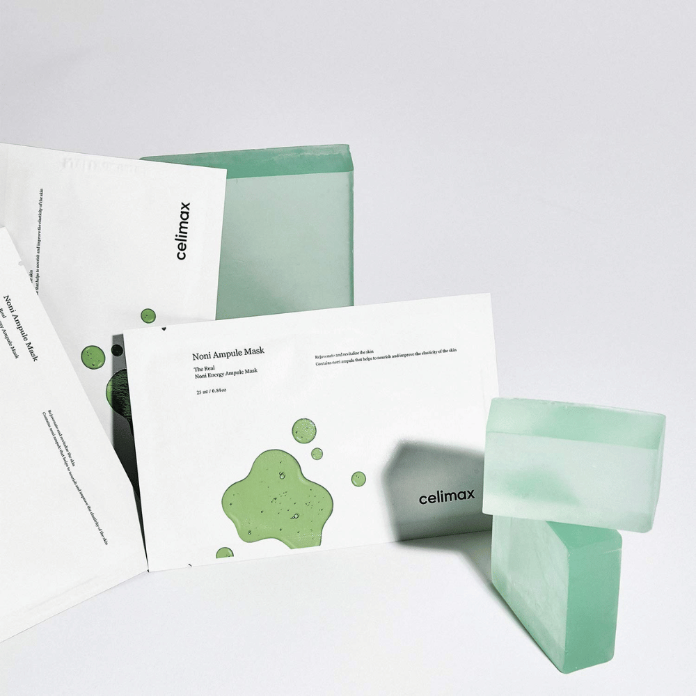 The Real Noni Energy Ampoule Mask von Celimax bietet eine effektive und feuchtigkeitsspendende Behandlung für die Haut. Mit seiner einzigartigen Formel hilft es, die Hautstruktur zu verbessern und Glanz zu verleihen. Die grüne Farbe der Masken und das frische Design vermitteln ein Gefühl von Natürlichkeit und Reinheit.