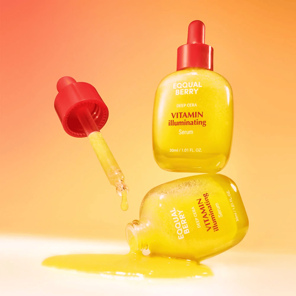 Equal Berry Vitamin Illuminating Serum in einer leuchtend gelben Flasche mit roter Pipette. Flüssige Textur und energetischer Hintergrund schaffen ein lebendiges und frisches Gefühl.
